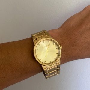 Worn gold Nixon watch- beautiful condition, changed battery since purchased
